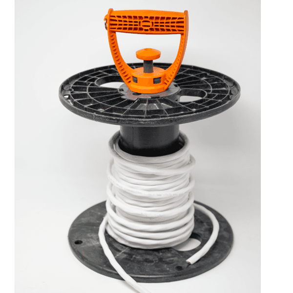 The ER-GO 50 wire reel carrying handle inserted into a reel with a spool of white wire.