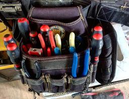 The pouch of a Rack-A-Tiers Electrician’s Combo Tool Belt and Bag with many electrician’s tools in the pockets.